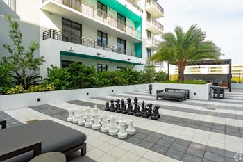 A giant chess set is set up on our courtyard at Hollywood Heights on the Boulevard Luxury Apartments in Hollywood, FL